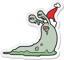 gross sticker cartoon of a slug wearing santa hat vector