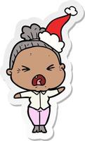 sticker cartoon of a angry old woman wearing santa hat vector