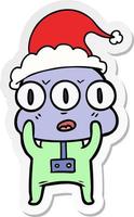 sticker cartoon of a three eyed alien wearing santa hat vector