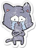distressed sticker of a cartoon crying cat vector