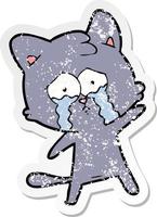 distressed sticker of a crying cartoon cat vector