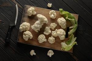 Raw, fresh organic cauliflower on a wooden background. Healthy eating, low carb diet concept photo