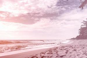 Landscape of tropical beach nature with coconut tree and clouds on horizon in Thailand. Summer relax outdoor concept. - vintage color filter photo