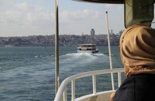 Woman on a ferry boat in Istanbul photo