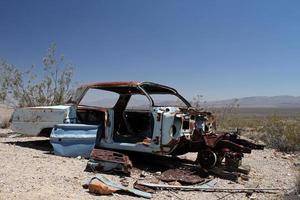 Wrecked and rusty car in Death Valley photo