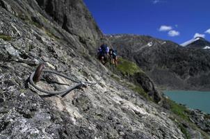 Hiking and climbing through the beautiful landscape of Norway photo