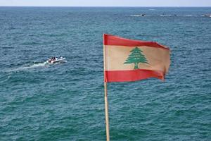 Lebanese flag waving at the coast of Beirut, Lebanon photo