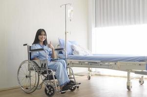 Hopeful and happy young patient woman in hospital, healthcare and medical concept photo