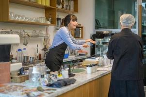 Angry customer complaining about barista in coffee shop photo