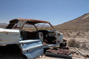 Wrecked and rusty car in Death Valley photo