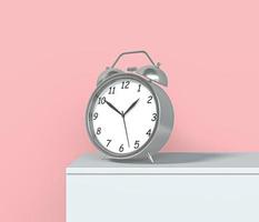 Old table clock 3d icon. Realistic alarm clock. Classic Silver color Table clock with timer. Morning Time management vintage instrument. Retro alarm clock front view. 3D Rendered Illustration photo