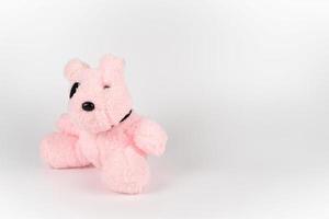 One pink dog doll with the black area around it eye. photo