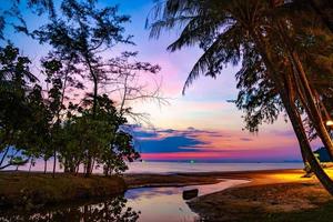 Purple violet sky at the beach and sea, in Twilight Time, Koh Kood, Trad province, Thailand. photo