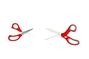 two red scissors, one big, one small are isolated on white background. Clipping paths photo