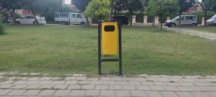 A trash can in the park photo