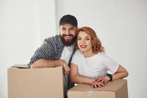 Sincere smiles. Happy couple together in their new house. Conception of moving photo