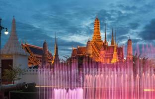 The emerald temple and the royal palace of Bangkok, the iconic landmark of Bangkok the capital city of Thailand at dusk. photo