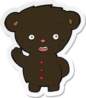 sticker of a cartoon waving black bear cub vector