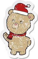 retro distressed sticker of a cartoon christmas teddy bear vector