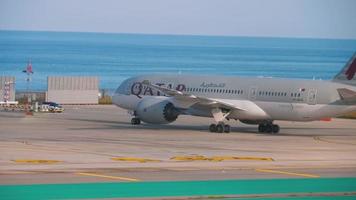 PHUKET, THAILAND   NOVEMBER 22, 2018 - Qatar Airways Boeing 787 Dreamliner A7 BCG taxiing after landing at Phuket International airport, early morning video