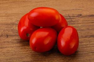 Red bright tasty tomato heap photo