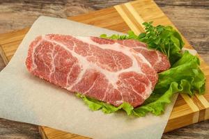 Raw pork meat neck steack photo