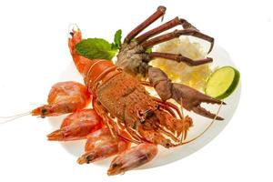 Spiny lobster, shrimps, crab legs  and rice photo