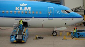 AMSTERDAM, THE NETHERLANDS   JULY 29, 2017 - KLM Royal Dutch Airlines Boeing 737 PH BXY named Grebe at loading luggage, Schiphol Airport, Amsterdam, Holland video