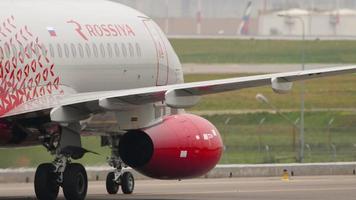 MOSCOW, RUSSIAN FEDERATION   JULY 28, 2021 - Sukhoi Superjet 100 of Rossiya taxiing on the runway for departure at Sheremetyevo Airport -SVO-. Airplane on the runway, summer day video