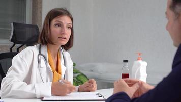 Doctor patient medication. The doctor informs the patient about the use of drugs. video