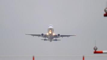 DUSSELDORF, GERMANY   JULY 24, 2017 - LOT Polish Airlines Embraer ERJ 175 SP LIO departure at rainy weather, early morning, Dusseldorf Airport video