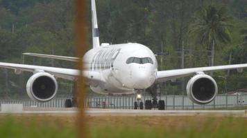 PHUKET, THAILAND   DECEMBER 1, 2018 - Finnair Airbus 350 OH LWI taxiing after landing, Phuket airport video