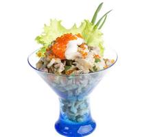 Salad with shrimp, avocado, tomatoes, red caviar photo