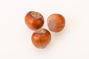 Hazelnut heap isolated over background photo