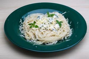Pasta with blue cheese and basil photo