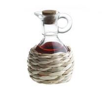 Small decanter with red wine vinegar isolated on the white photo