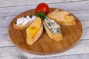 Bruschetta with various cheeses photo