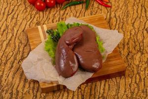 Raw pork kidneys photo