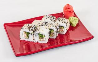 Japanese traditional Cuisine - Maki Roll with Nori , Cream Cheese and Eel. Isolated over white background. Isolated over white background photo