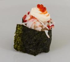 sushi kani with sauced slices of crab shrimp isolated on white background photo