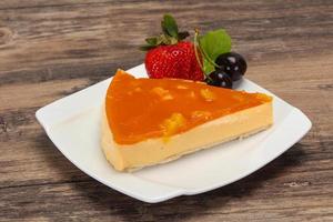 Cheesecake with apricot served strawberry photo
