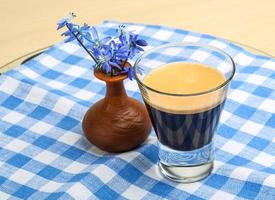 Espresso with spring flower photo