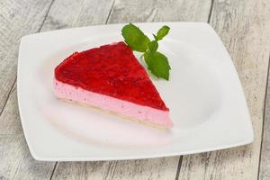 Soft Raspberry cheesecake served mint photo