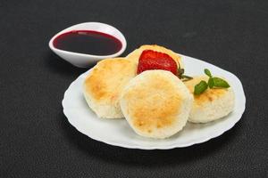 Curd pancakes with jam and stravberry photo