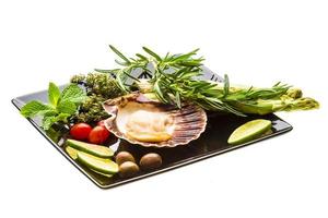 Scallop with asparagus, lime, mint and rosemary photo