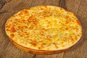 Georgian cuisine - round khachapuri with meat photo