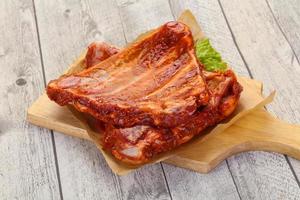 Raw marinated pork ribs photo