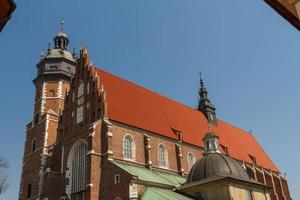 Cracow - Corpus Christi Church was founded by Kasimirus III The Great about 1340. The front elevation has a gothic gable whilst decoration of the interior is baroque photo