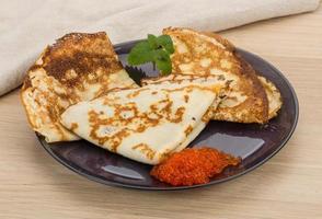 Pancakes with red caviar photo