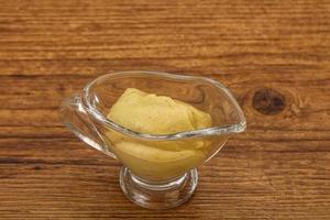 Dijon mustard sauce in the bowl photo